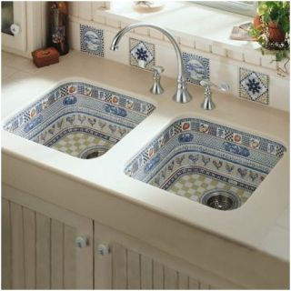 Photo shows two kitchen sinks without bottom basin racks. Faucet and