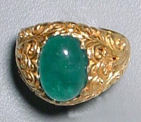 This Columbian Emerald cabochon shimmers with bright green clarity